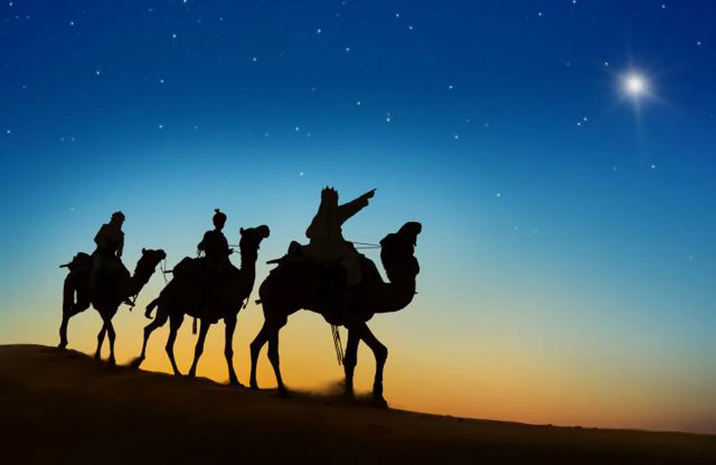 Three riders on camels crossing the desert at dusk beneath a bright star